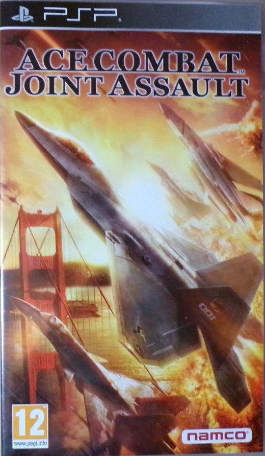 PSP game case for Ace Combat Joint Assault, featuring artwork of fighter jets and a bridge, photographed on a plain tan surface.