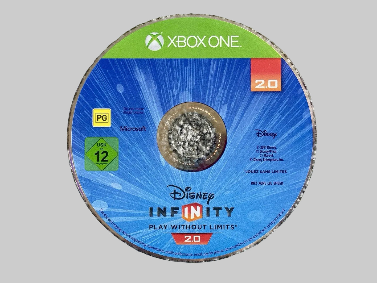 A used Xbox One Disney Infinity 2.0 game disc resting on a gray textured carpet.