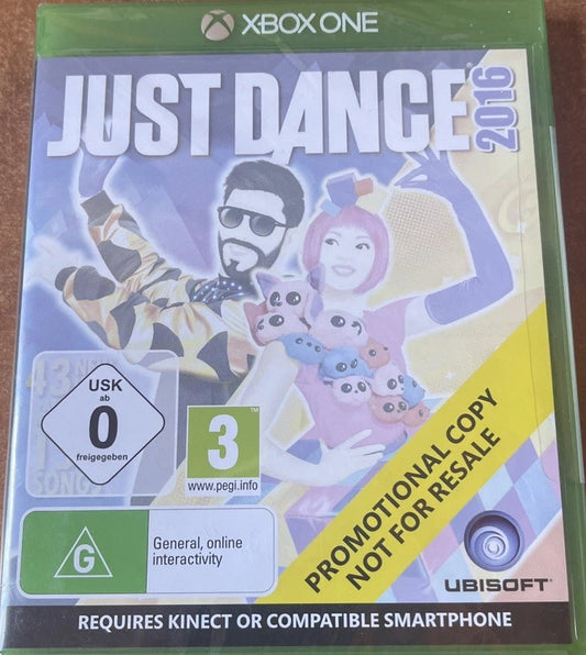 Xbox One game case for Just Dance 2026 on a brown wooden tabletop. The front cover shows colorful illustrated characters, a yellow diagonal banner reading 'Promotional Copy Not for Resale,' and Ubisoft branding.